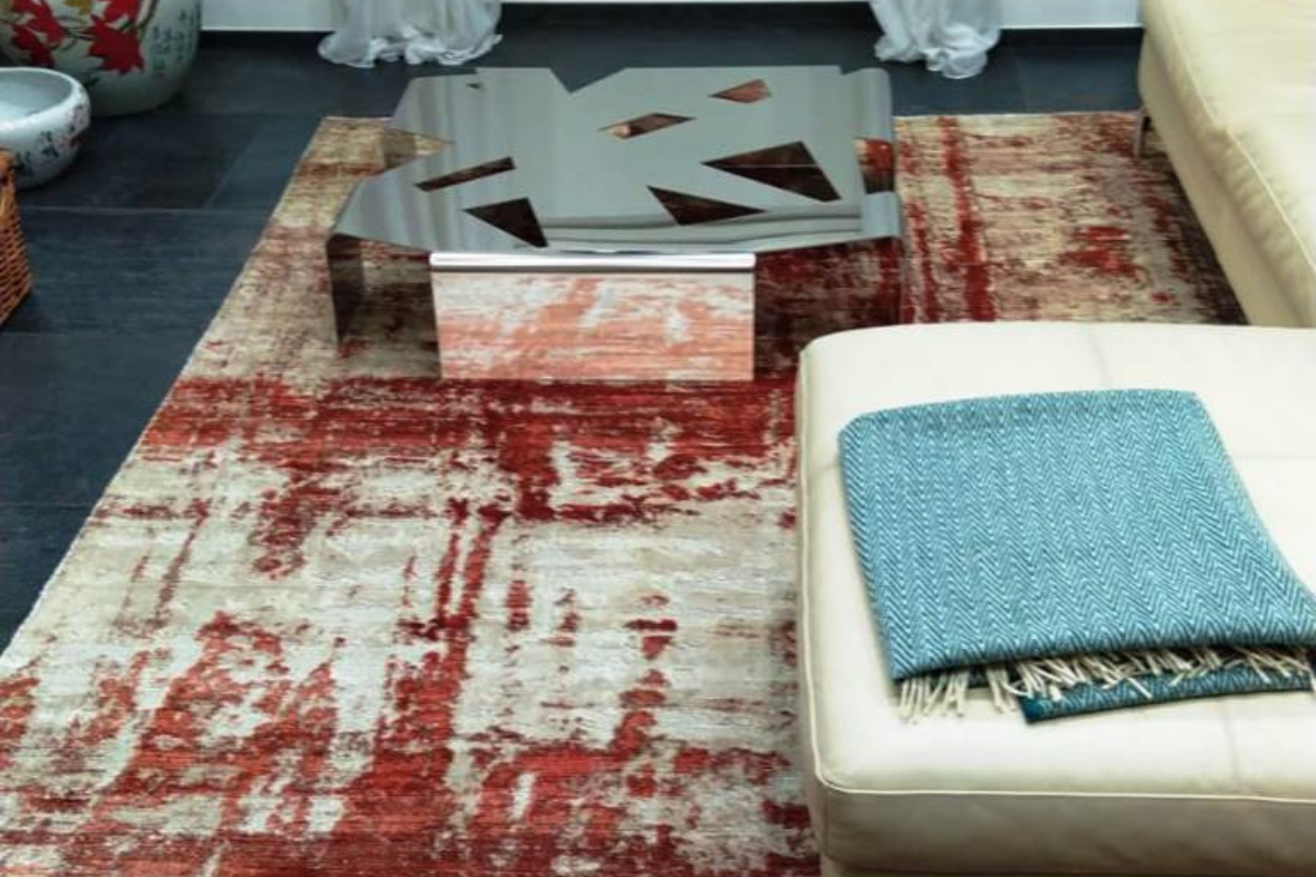 tappeti per ufficio e studi Tappeto moderno di Adamello Tappeti posto in un ufficio, vicino divano in pelle bianca